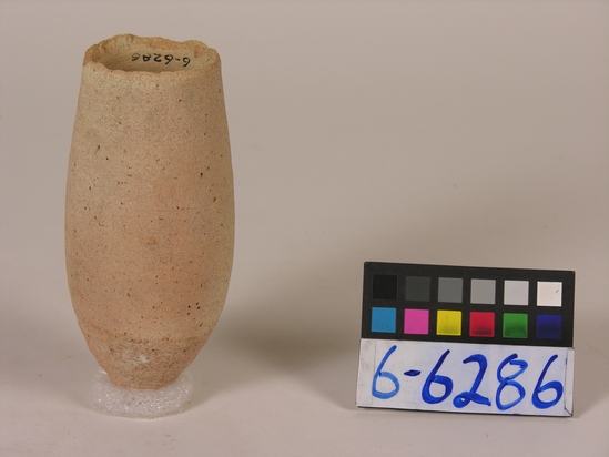 Hearst Museum object titled Beer cup, accession number 6-6286, described as Pottery, deep pointed-bottomed buff cup, rim chipped: least diameter 5 cm, greatest diameter 6.5 cm, height 15 cm