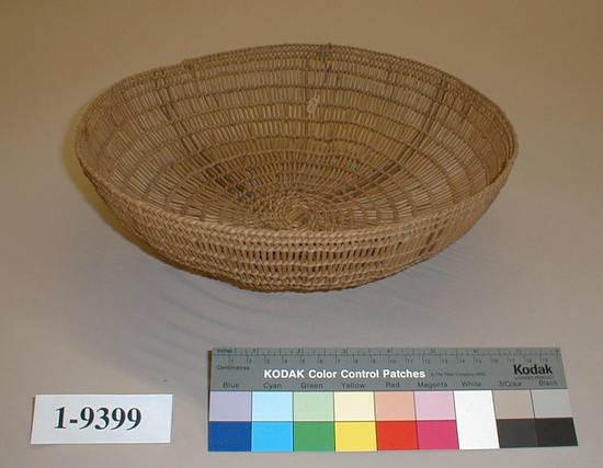 Hearst Museum object titled Basket tray, accession number 1-9399, described as Openwork tray basket; twined. Warp is Willow (Salix), weft is Alder root (Alnus) and Hazel (Corylus cornuta californica). Black color is mud-dyed. Plain twined.  Four stripes of black dyed warp.