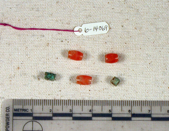 Hearst Museum object titled Beads, accession number 6-14069, described as Beads: 3 carnelian barrel-shaped (biconical), 2 cylindrical faience.