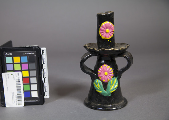 Hearst Museum object titled Candlestick, accession number 3-32131, described as Polychrome and glazed ceramic candlestick-holder ornament with floral decorative motifs.