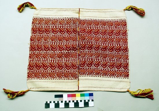 Hearst Museum object titled Tzute, accession number 3-56, described as Men’s headcloth (tzute); white cotton; red and orange brocade; tassels at corners of orange, red and yellow; approximately 58 cm x 50 cm