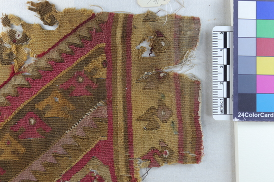 Hearst Museum object 3 of 5 titled Tapestry fragment, accession number 16-980, described as Fragment of heavy finely woven tapestry decorated with bird and step design