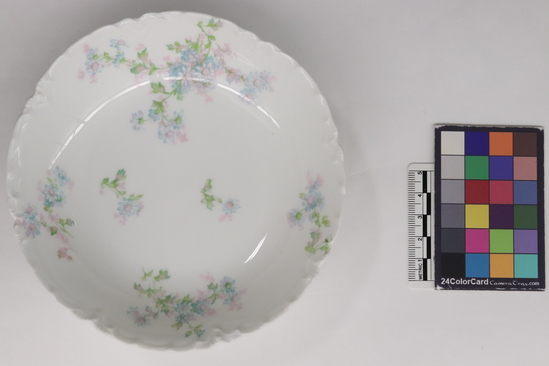 Hearst Museum object titled Sauce dish, accession number 7-3738, described as Sauce dish; white; glazed; blue, pink, green, floral  design; gold leaf; fluted rim and foot. Diameter 5 5/8 inches. 7-3697 - 3743 are one dinner set.