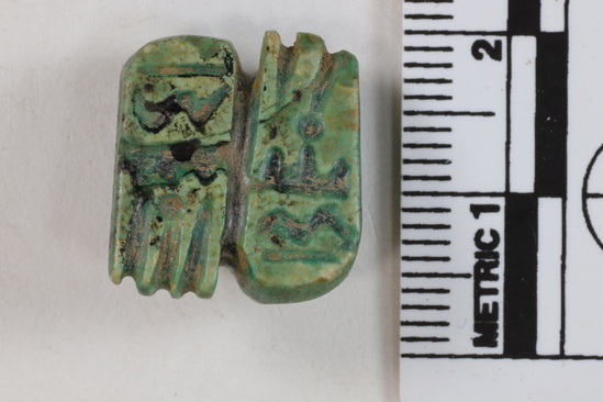 Hearst Museum object 8 of 9 titled Amulet seal, accession number 6-22123, described as Pyramidal amulet-seal; 16x17 mm, of greenish faience