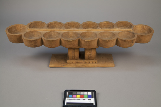 Hearst Museum object titled Warri board, accession number 5-11692, described as Carved wood game board.