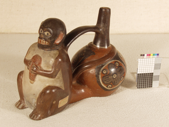 Hearst Museum object titled Whistling jar, accession number 4-8543, described as Brown double whistling jar, one half representing a monkey holding an ear of corn, the other an ordinary bottle-necked vase, spout connected to monkey with arched handle; Height: 13.5 cm, Width/breadth: 17.5 cm, Depth: 9.5 cm