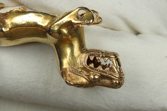 Hearst Museum object 6 of 6 titled Dog figurine, accession number 3-3420, described as Gold figurine of a dog.