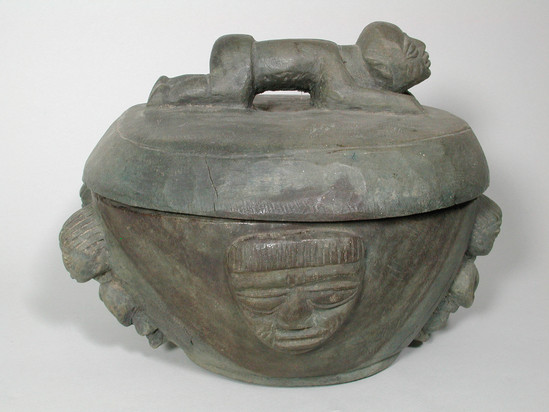 Hearst Museum object 2 of 2 titled Bowl and cover, accession number 5-7637a,b, described as a) bowl;  wood;  with b) cover, carved figure as lid handle;  figures on side of bowl of carved wood;  green in color.  H. 26 cm. W. 30 cm.