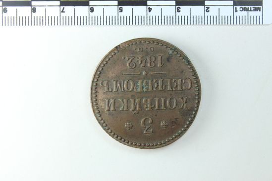 Hearst Museum object 2 of 4 titled Coin: copper 3 kopek, accession number 7-4449, described as Coin; obverse: I.C. (or H., can't discern); I; reverse: 3 копъейки серебромь C.M. 1842; transl. 3 silver kopecks S.M. 1842; framed by dot design; weight: unknown.