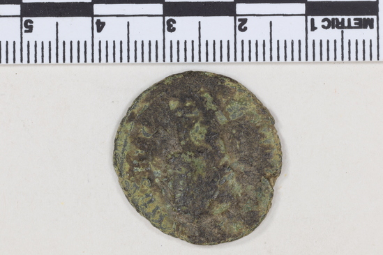 Hearst Museum object 6 of 7 titled Coin: æ as, accession number 8-6236, described as Coin; Æ; aes grave; as; Aurelian - 6.08 grams. Obverse: illegible; bust facing right, laureate, cuirassed. Reverse: CONCOR... I [over untranscribable symbols]. Emperor and Concordia clasp hands.