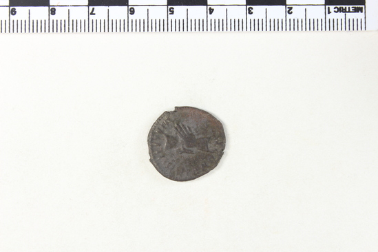 Hearst Museum object 7 of 8 titled Coin: billon antoninianus, accession number 8-4380, described as Coin; Billon; Antoninianus; Roman. 3.14 grams; 21 mm. Marius, 268 AD. Cologne, Germany. Obverse: IMP C MARIVS P F AVG, bust r. radiate. Reverse: CONCORDIA MILITVM, Clasped hands.