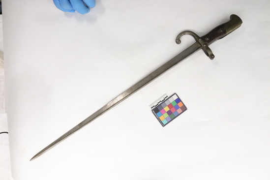 Hearst Museum object titled Bayonet, accession number 7-1612, described as Bayonet, wooden handle; inscribed “Alsine de Steyr 1878.” Length 25 inches.