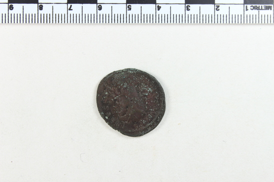 Hearst Museum object 2 of 8 titled Coin: billon antoninianus, accession number 8-4068, described as Coin; Billon; Antoninianus; Roman. 5.40 grams, 26 mm. Aurelian, 270-275 AD. Rome, Italy. Obverse: IMP C AVRELIANVS, Bust r. radiate. Reverse: ORIENS AVG, Sol l., between two captives, in exergue T M