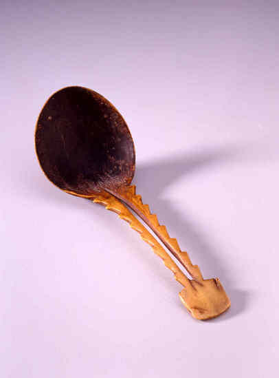 Hearst Museum object titled Spoon, accession number 1-1100, described as Made of elk antler, handcarved.  Oval bowl.  Slotted handle with dentate edges.