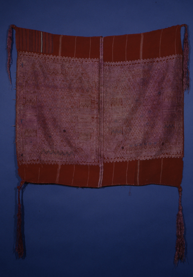 Hearst Museum object 2 of 3 titled Tzute, accession number 3-29644, described as Tzute: Backstrap-loomed, warp predominant plain weave. Two-faced suppl. weft brocading. Two pieces joined by randa. End selvedges hemmed by hand-stitching. 8 1/2" silk floss tassels at each corner.