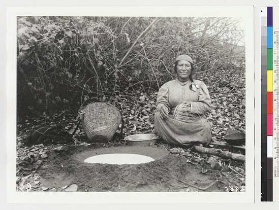 Hearst Museum object titled Black-and-white negative, accession number 15-2985, described as Mrs. Freddie making a basket by the acorn meal place