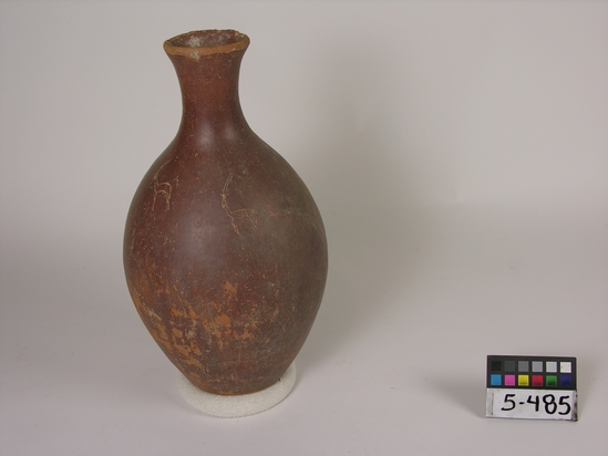 Hearst Museum object titled Bottle, accession number 5-485, described as Pottery bottle maroon polished 3 crude incised animal designs