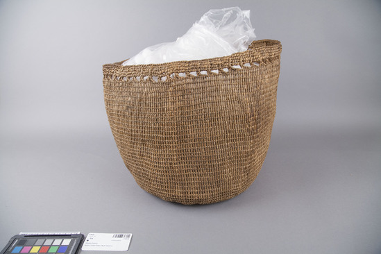 Hearst Museum object 3 of 4 titled Bag, accession number 2-4534, described as Bag of woven grass, along mouth strands of warp are brought together in little braids about 1 cm in length, spaced at intervals of 1.5 cm.  Made with grass in open twining (rye grass leaves).