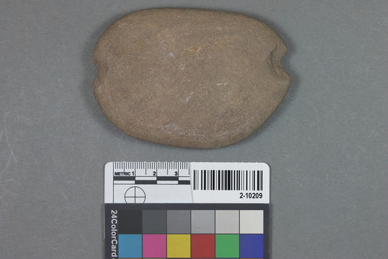 Hearst Museum object titled Net sinker, accession number 2-10209, described as Flat notched stone net sinker