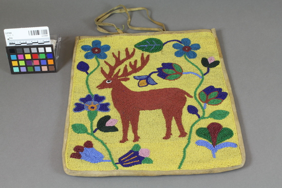 Hearst Museum object 2 of 3 titled Bag, accession number 2-37065, described as Made of beaded deerskin; yellow glass "seed" bead ground; brown deer motif with surrounding floral design. Thong handles.