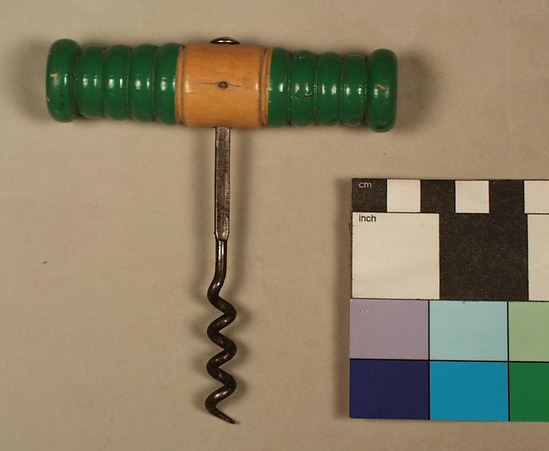 Hearst Museum object titled Corkscrew, accession number 2-68680, described as Corkscrew, tee handle; turned wood handle, green paint at each end, steel shank affixed to handle with pin, shank flattened at middle, helical worm, 11.3 cm long. Corkscrew for removing corks from wine bottles
