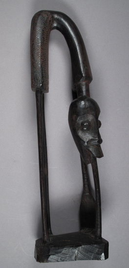 Hearst Museum object titled Sculpture, accession number 5-16988, described as dark wood, african Makonde sculpture, human figure bending in half