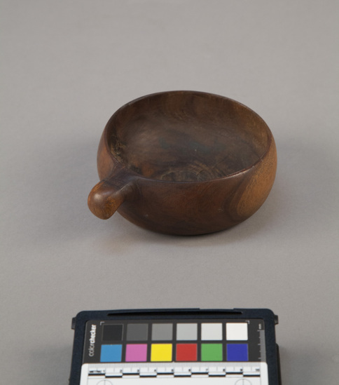 Hearst Museum object 1 of 2 titled Ipu kuha (spittoon), accession number 11-1239, described as Ipu kuha, "spittoon", small handled wooden bowl, in which chief's saliva was gathered and removed for his protection.