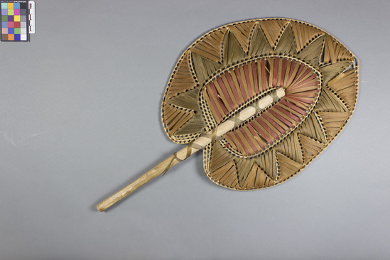 Hearst Museum object titled Fan, accession number 11-1640, described as Red, brown and green lace bark fan, white stick hibiscus bark.