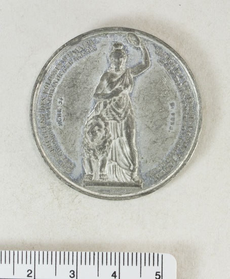 Hearst Museum object titled Coin: billon 2 taler, accession number 7-6197, described as Coin, billon. Two talers. German States (Bavaria). Obverse: Head, male, left. Inscribed "Ludwig Von Schwanthaler". Reverse: Standing female figure holding wreath aloft, with seated lion left. Legend in honor of Schwanthaler, colossus erected by Ludwig I King of Bavaria, 1825-1848.