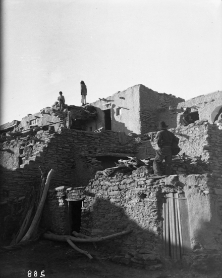 Hearst Museum object titled Black-and-white negative, accession number 15-288, described as Hopi man standing on rooftop early in the morning of Snake dance acting as “Town crier.”