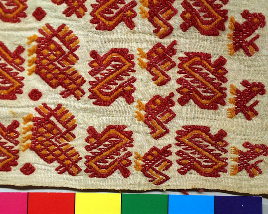 Hearst Museum object titled Xute, accession number 3-142, described as cap or Xute; also used around the neck; white cotton-gauzy plain weave, inconspicuous orange stipes, brocaded with red and orange cotton; long silk red and orange tassles on ends [handwritten: magenta and gold silk is colored with synthetic dyes (Carlson: See acc. envelope) Photo:  see Eisen archive in museum library; see also pg. 87 in Margot Schevill's book