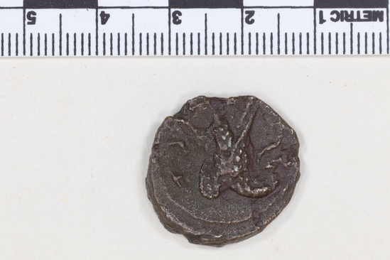 Hearst Museum object 5 of 8 titled Coin: billon, accession number 8-4837, described as Coin; Billon; Greek. 6.84 grams, 22 mm. Claudius II, 268-269 AD. Alexandria, Egypt. Obverse: AYTK KLAYΔΙΟC CEB, bust r. laureate. Reverse: Eagle l.; to right, monogram.