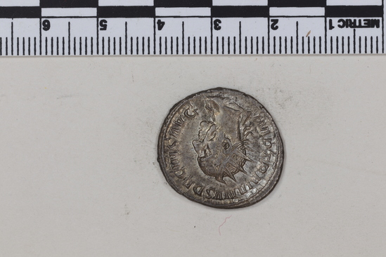 Hearst Museum object 7 of 8 titled Coin: ar antoninianus, accession number 8-4370, described as Coin; Billon; Antoninianus; Roman. 4.22 grams, 23 mm. Trajan Decius, 249-251 AD. Obverse: IMP TRAIANV DECIVS AVG, bust r. radiate. Reverse: GENIVS EXERCITVS ILLVRICIANI, genius standing l., military standard at r.