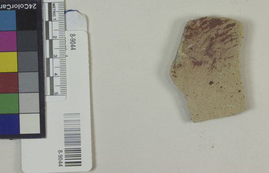 Hearst Museum object titled Fresco fragment, accession number 8-9044, described as Architectural Fragment of house; plaster with red paint; Approximately 5.5 cm X 3.8 cm X .5 cm