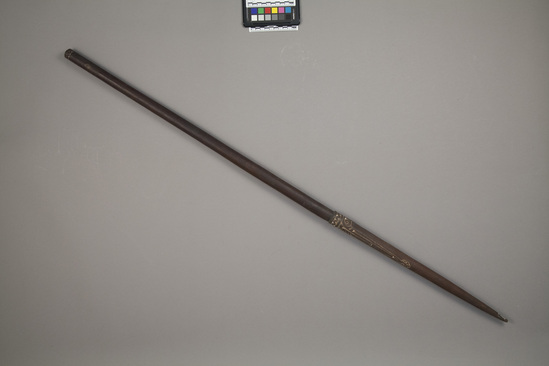 Hearst Museum object titled Walking stick, accession number 11-39848, described as Sparring club/ walking stick/ swagger stick of red brown wood, relief decoration mainly near distal end, which is pointed like a Trobriand spear. 112.4 cm length