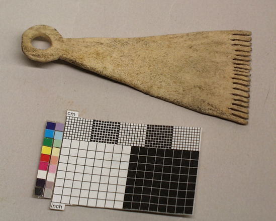 Hearst Museum object titled Comb, accession number 2-4234, described as Hair comb; carbou antler; multiple teeth; triangular; hole handle end.