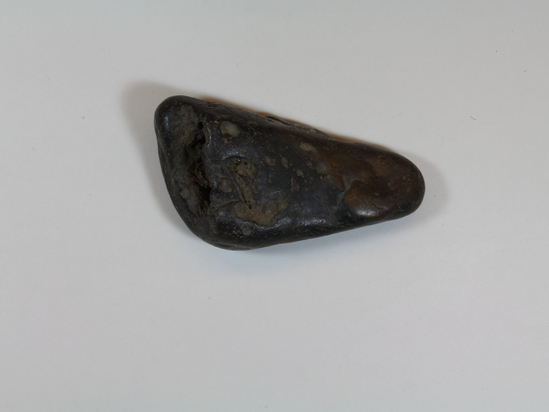 Hearst Museum object 3 of 4 titled Sinker (fishing), accession number 1-949, described as Peforated stone.