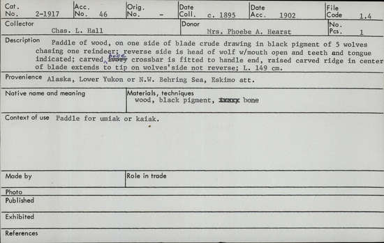 Documentation associated with Hearst Museum object titled Paddle, accession number 2-1917, described as Paddle of wood, one one side of blade crude drawing in black pigment of 5 wolves chasing one reindeer.  Reverse side is head of wolf with mouth open and teeth and tongue indicated.  Carved bone crossbar is fitted to handle end.  Raised carved ridge in center of blade extends to tip on wolves side not reverse.