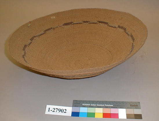 Hearst Museum object titled Basket, accession number 1-27902, described as Twined, shallow, with circular brown design. Round, flaring sides.