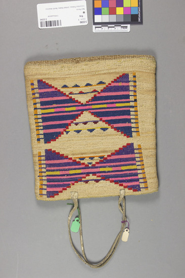 Hearst Museum object 6 of 8 titled Bag, accession number 2-22260, described as Multi-colored corn husk bag; cornhusk and wool overlay in plain twining; geometric designs in colored wool yarn on both faces; 2 rawhide thong handles.