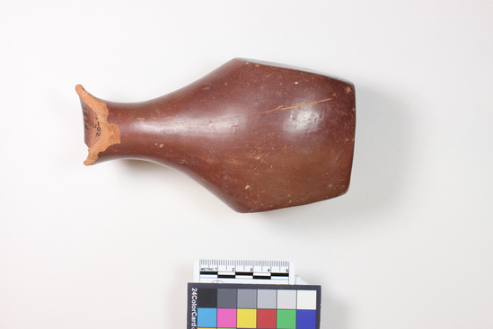 Hearst Museum object 3 of 12 titled Broken bottle, accession number 6-3214, described as Pottery: red bottle flat bottom two flat sides slender neck broken gd 8 cm, height 15 cm