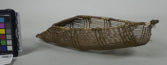 Hearst Museum object 2 of 3 titled Cradle model, accession number 1-67927, described as Basketry cradle. Openwork twining. Broken at top.