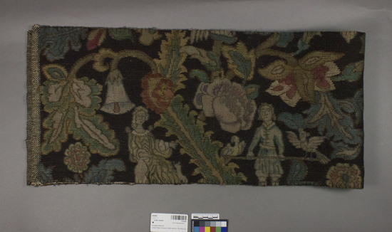 Hearst Museum object titled Textile sample, accession number 2-62426, described as Strip; cotton, wool, colors dark blue ground, varicolored designs, floral, human and animal motives, Jacquard looms