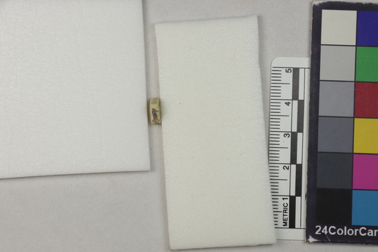 Hearst Museum object 6 of 6 titled Fragment, accession number 5-13186, described as Fragment, heavily eroded, cross-shaped with checkered design, 1 cm square.