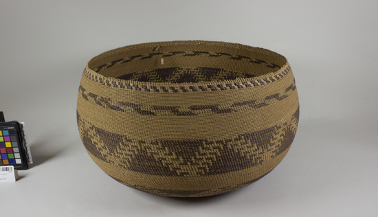 Hearst Museum object 2 of 2 titled Basket, accession number 1-28797, described as Twined. Lattice. Brown design in encircling bands, not overlay.