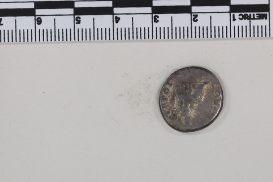 Hearst Museum object 8 of 8 titled Coin: ar denarius, accession number 8-4665, described as Coin; AR; Denarius; Roman. 3.07 grams, 18 mm. Vespasian, 69-70 AD. Rome, Italy. Obverse: IMP CAESAR VESPASIANVS AVG, bust r. laureate. Reverse: COSITER TR POT, Pax seated left holding caduceus and branch.