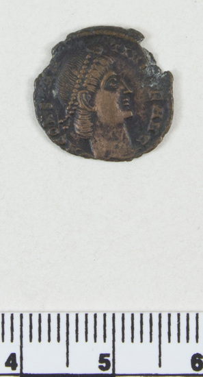 Hearst Museum object titled Coin: æ, accession number 8-8589, described as Coin; bronze; obverse: head of Constantine I; reverse: standards between soldiers