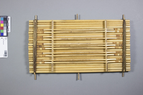 Hearst Museum object titled Zither, accession number 5-3030, described as Cane Zither; Yom Kwo; composed of a series of cane lashed together, "stings" made from split cane; pitch controlled by wrapping varying thicknesses of fiber around "strings".