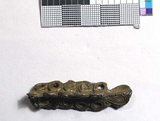 Hearst Museum object titled Gold weights, crayfish, accession number 5-10522, described as Goldweight, brass, lost wax cast; crayfish tail, three columns of circles attached to a center rod, 16.91 gm. weight called onansoa/osoa. The everyday businessman's weight for the amount of gold dust used as money in much of West Africa from the 1400s through the 1800s.