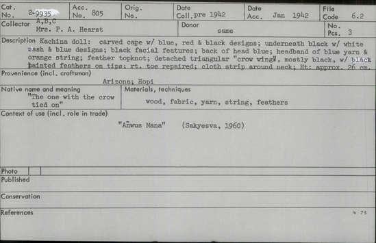 Documentation associated with Hearst Museum object titled Kachina doll, accession number 2-9935a-c, described as Carved cape with blue, red and black designs; underneath is black with white sash and blue designs; black facial features; back of head blue; headband of blue yarn and orange string; feather topknot; detached triangular "crow wings", mostly black, with black painted feathers on tips; right toe repaired; cloth strip around neck. Made of wood.